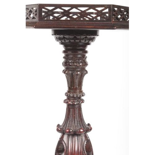 281 - A Chippendale style mahogany wine table with hexagonal top having open fret gallery. Raised on an op... 