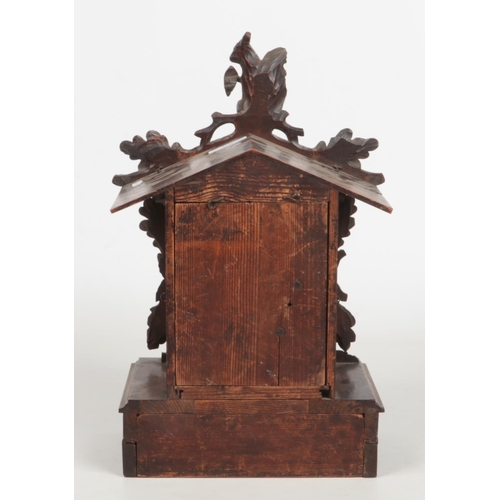 65 - A 19th century Black Forest cuckoo clock striking on a gong. Carved with a squirrel and acanthus lea... 