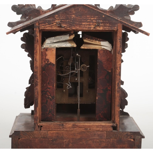 65 - A 19th century Black Forest cuckoo clock striking on a gong. Carved with a squirrel and acanthus lea... 