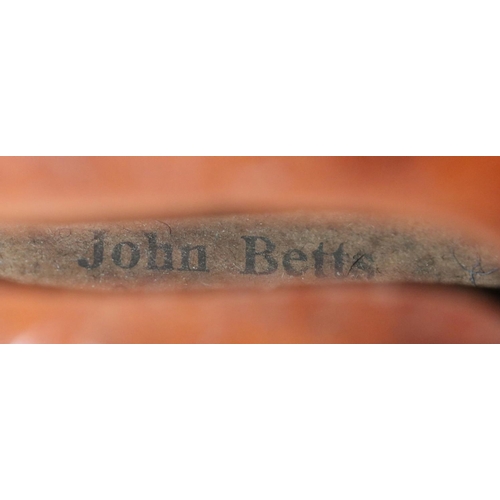 85 - A cased violin and bow. Label for John Betts, Royal Exchange. Stamped to the reverse underneath the ... 