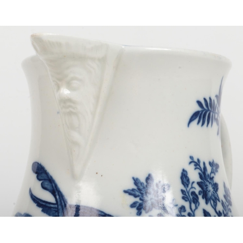 95 - A Caughley baluster shaped mask jug. Printed in underglaze blue with the Parrot Pecking Fruit patter... 