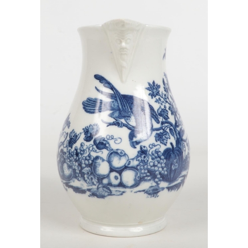 95 - A Caughley baluster shaped mask jug. Printed in underglaze blue with the Parrot Pecking Fruit patter... 