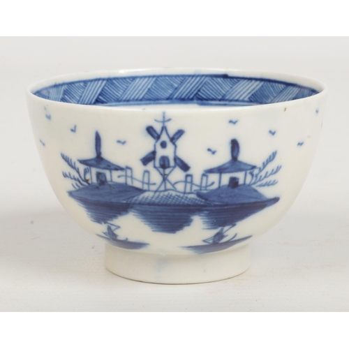 97 - a Caughley teabowl and saucer. Painted in underglaze blue with the Bridge and Windmill pattern c.178... 