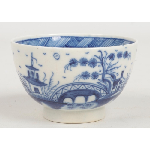 97 - a Caughley teabowl and saucer. Painted in underglaze blue with the Bridge and Windmill pattern c.178... 