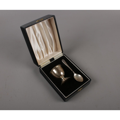 315 - A silver egg cup and spoon made by B&Co (Broadway & Co) in a presentation box, probably as a christe... 