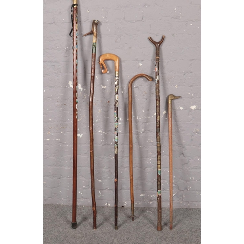 371 - A collection of walking sticks, carved, animal form handles examples