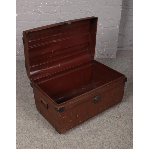 373 - A metal trunk with handles to each side, 65 x 43 x 37 cm.