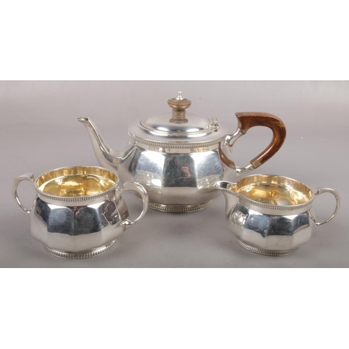 303 - A George V silver three part teaset by Mappin and Webb, assay marks for Sheffield 1920 and 1927. (71... 