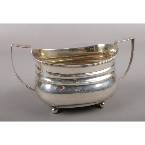 307 - A George III silver twin handled sucrier raised on four ball feet, assayed London 1810, maker's mark... 