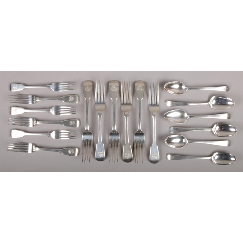 313 - Assembled silver cutlery, all bearing the same crest, to include a set of six George III silver spoo... 