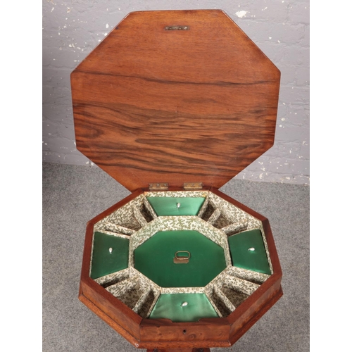 449 - A rosewood and mahogany workbox with walnut veneer and ornate carved mahogany supports.