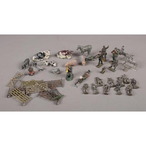 101 - A collection of lead and metal figures, to include Britains, farm animals, soldiers etc.