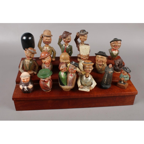 105 - A collection of Anri Mechanical Vintage Italian wooden bottle stoppers, Man putting on glasses, Man ... 