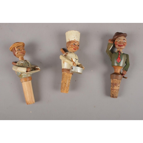 105 - A collection of Anri Mechanical Vintage Italian wooden bottle stoppers, Man putting on glasses, Man ... 