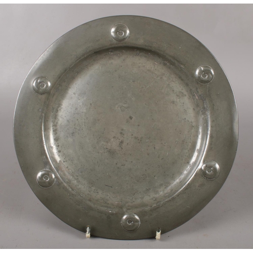 106 - A Tudric pewter Arts & Crafts dish, diameter 24cm.