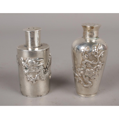 321 - Two Chinese silver pepperettes, one decorated with a dragon and the other with prunus blossoms. Mark... 