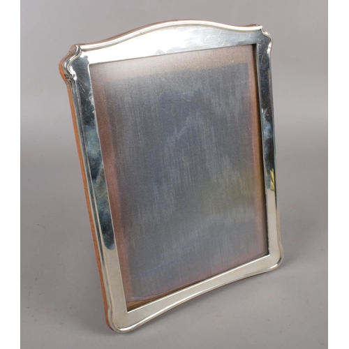 328 - A George V silver mounted easel photo frame with oak back, assayed Birmingham 1916 by A & K Zimmerma... 