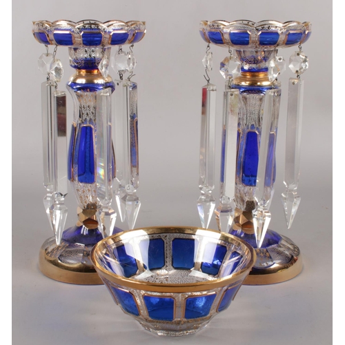 330 - A pair of clear glass lustres, with Bristol blue panels and gilt decoration, along with matching bow... 