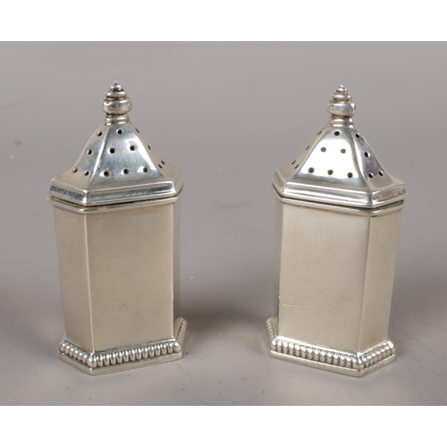 334 - A pair of silver pepperettes, assayed Birmingham 1929. 60g.