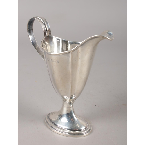 345 - An Edwardian silver cream jug assayed Birmingham 1908. (88g).