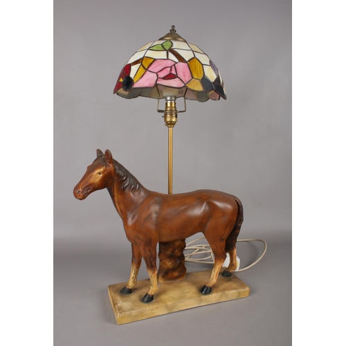 67 - A retro chalk table lamp in the form of a horse together with a Tiffany style lamp shade. Total heig... 