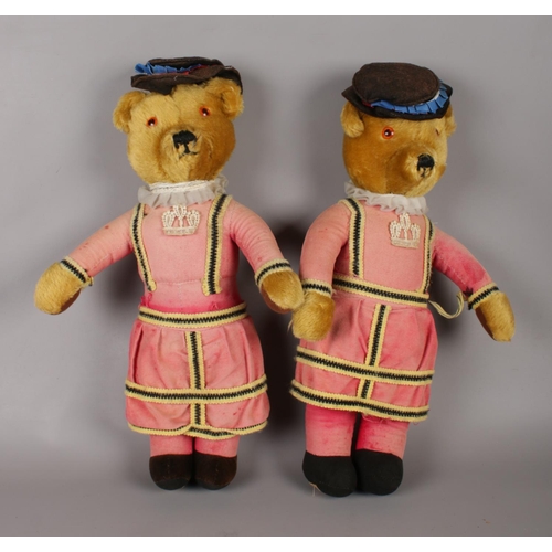 70 - Two Merrythought beefeater mohair bears with glass inset eyes.