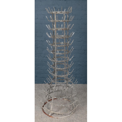 362 - A vintage French galvanised bottle drying rack. (Height approximately 150cm).