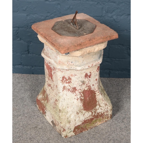 364 - A composition stone base pedestal sundial (49cm height 30cm width)