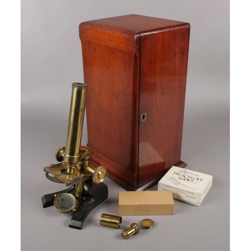 78 - A mahogany cased brass monocular microscope by R Field & Son, Birmingham.