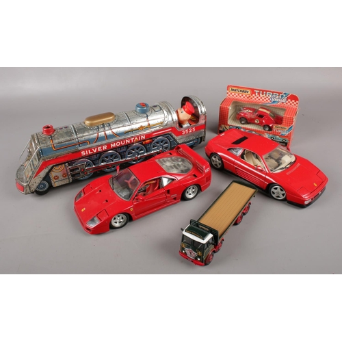 79 - A Japanese Masudaya tinplate Silver Mountain train, along with a quantity of diecast vehicles, to in... 