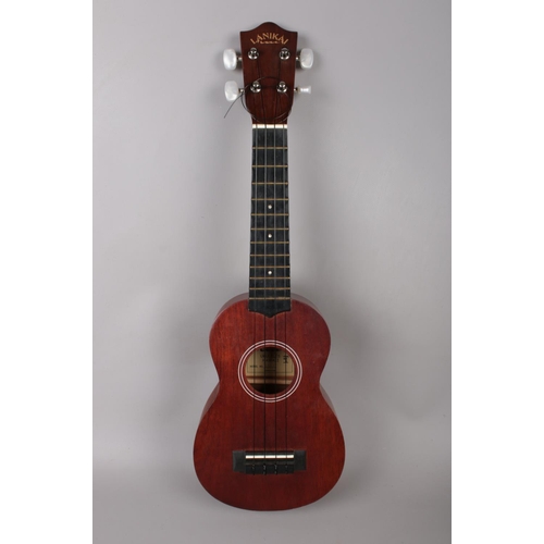 376 - A Lanikai Hawaiian Ukulele model no LU-11, together with a soft carry case, a Chromatic tuner, SUU03... 