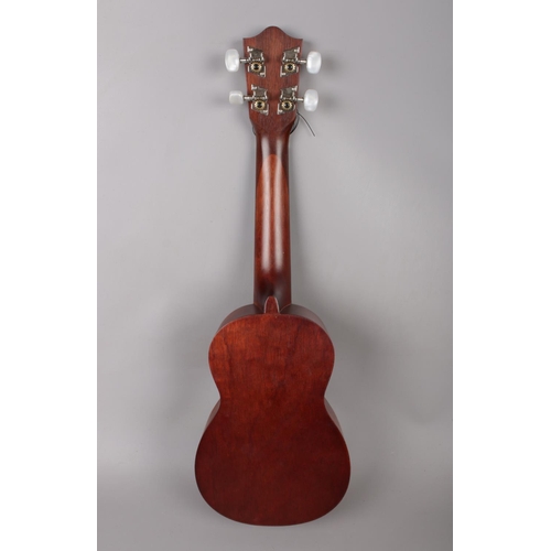 376 - A Lanikai Hawaiian Ukulele model no LU-11, together with a soft carry case, a Chromatic tuner, SUU03... 