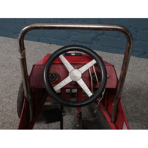 382 - A vintage metal and chrome child's pedal car with number plate 1938. Length 77cm, width 40cm.