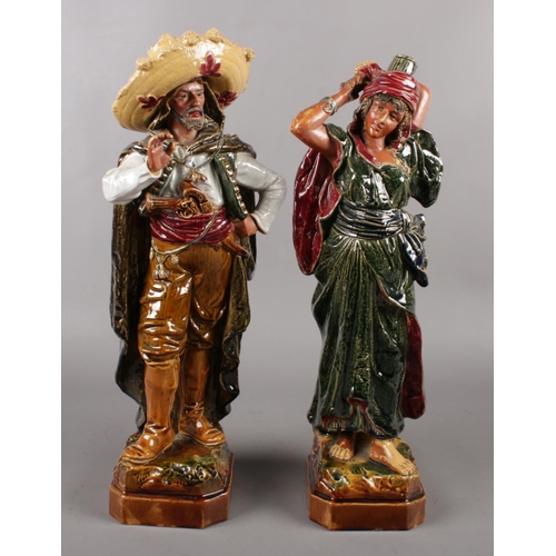 80 - A pair of large pottery figures of a Mexican couple, possibly German, incised mark to base. (Height ... 