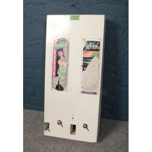 391 - A metal condom vending machine. Height 85cm, width 38cm and depth 12.5cm.