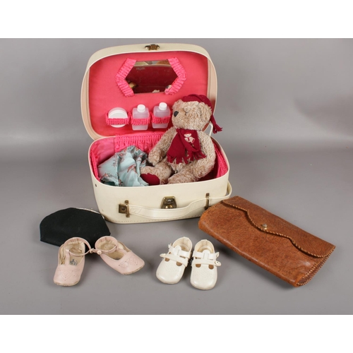 397 - A 1950's vanity case with mirror and bottles to include The Tenax handbag, Harrods Teddy, French pur... 