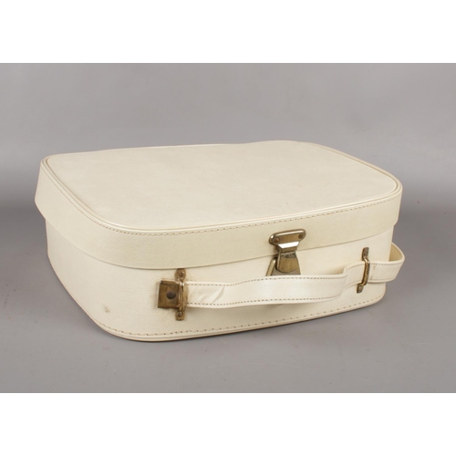 397 - A 1950's vanity case with mirror and bottles to include The Tenax handbag, Harrods Teddy, French pur... 