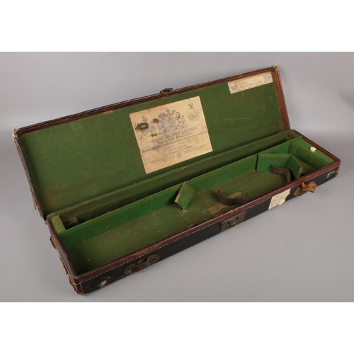 399 - A vintage leather bound gun case, with label for James Dalziel Dougall, gun and rifle manufacturer. ... 