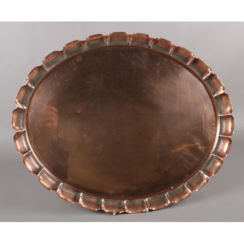 84 - A Newlyn Arts & Crafts oval copper tray. (41cm x 51cm).