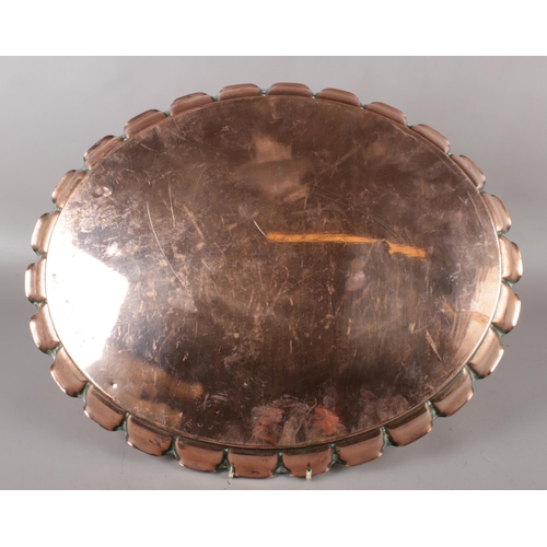 84 - A Newlyn Arts & Crafts oval copper tray. (41cm x 51cm).