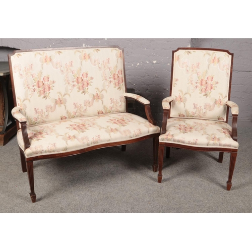 419 - A Salon Suite comprising of a two seated settee and elbow chair, upholstered in a cream and floral p... 