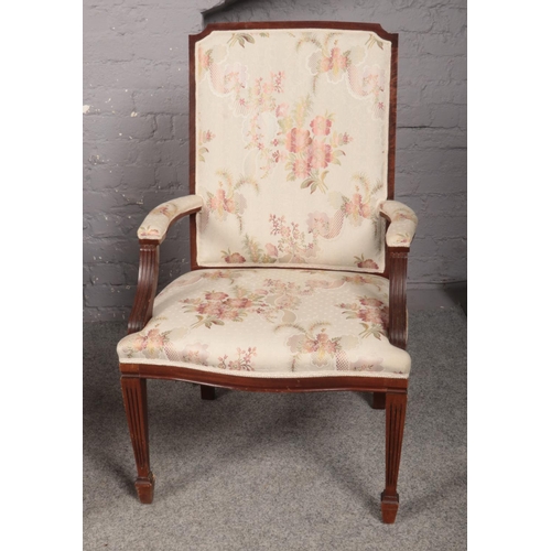 419 - A Salon Suite comprising of a two seated settee and elbow chair, upholstered in a cream and floral p... 