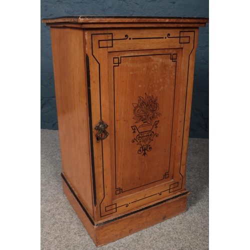 421 - A Victorian side cabinet with painted ebonised decoration on the top and door. Inside a single shelf... 