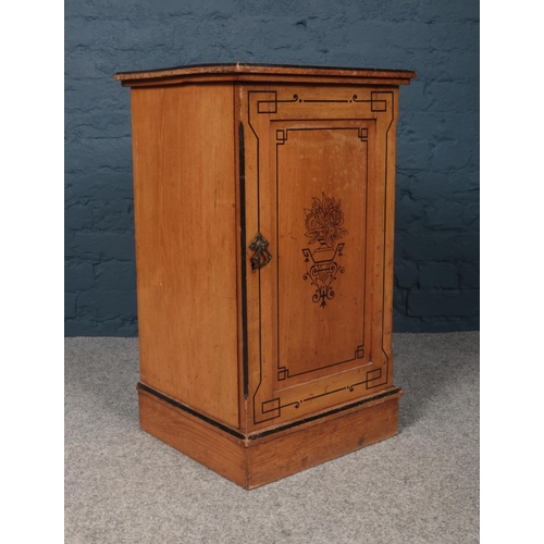 421 - A Victorian side cabinet with painted ebonised decoration on the top and door. Inside a single shelf... 