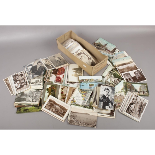 116 - A box of vintage postcards to include colour and monochrome examples etc.