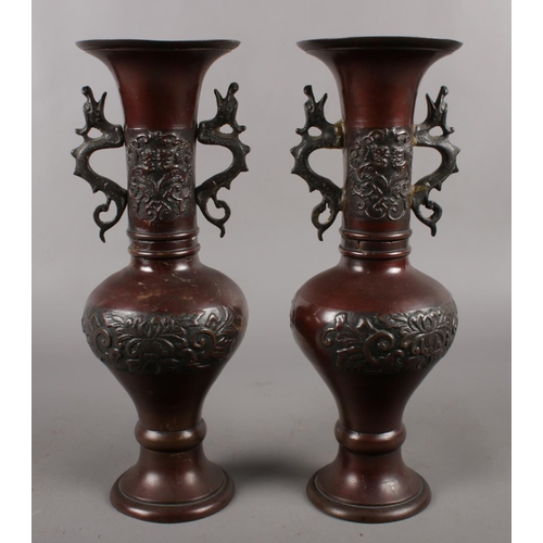 125 - A pair of decorative Chinese bronze vases (height 30cm).