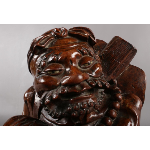 126 - A carved Chinese hardwood figure (approximately 30cm).