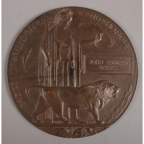 351 - A bronze WWI death plaque for John Edward Barnes.