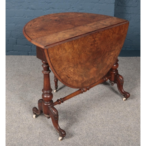 432 - A Victorian walnut Sutherland table, with inlaid decoration.