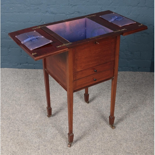 433 - A Victorian mahogany work/sewing box raised on tapering supports.